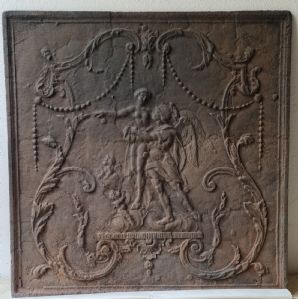 Cast iron fireplace plate decorated with a mythological scene